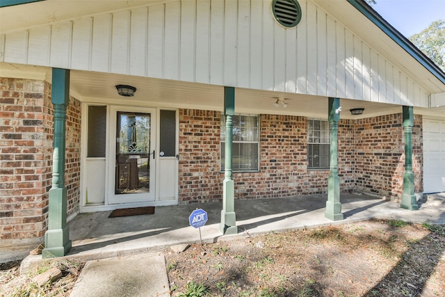 1805 Twila Ln, Conroe, TX 77301 - property entrance featuring brick siding and a porch