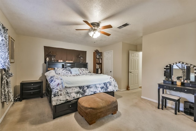 1805 Twila Ln, Conroe, TX 77301 - bedroom with light colored carpet, baseboards, ceiling fan, and a textured ceiling