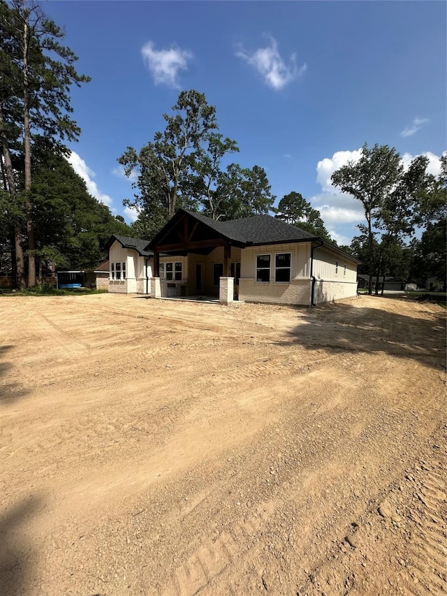 2439 Centurian Cir, Roman Forest, TX 77357 - view of front of home with dirt driveway