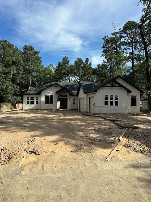 2439 Centurian Cir, Roman Forest, TX 77357 - view of front facade featuring a garage
