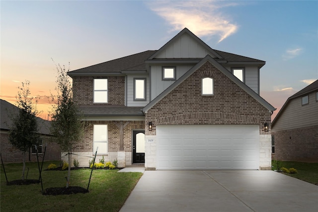18438 Windy Knoll Way, Houston, TX 77084 - view of front of property with driveway, a shingled roof, a lawn, board and batten siding, and brick siding