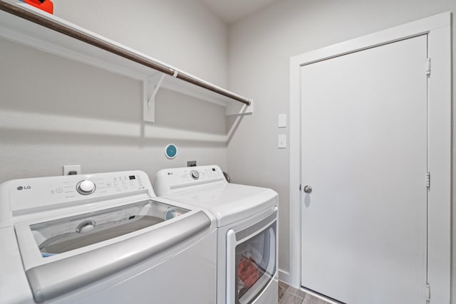 18438 Windy Knoll Way, Houston, TX 77084 - washroom featuring washing machine and clothes dryer and baseboards