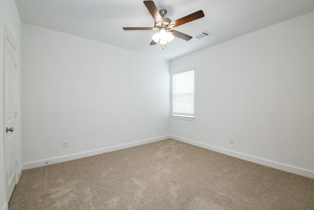 7974 Fowlie St, Houston, TX 77028 - empty room featuring light carpet, a ceiling fan, and baseboards