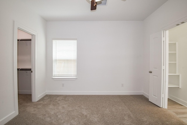 7974 Fowlie St, Houston, TX 77028 - unfurnished bedroom with a spacious closet, light carpet, a closet, and baseboards