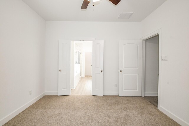 7974 Fowlie St, Houston, TX 77028 - unfurnished bedroom featuring carpet, baseboards, and a ceiling fan