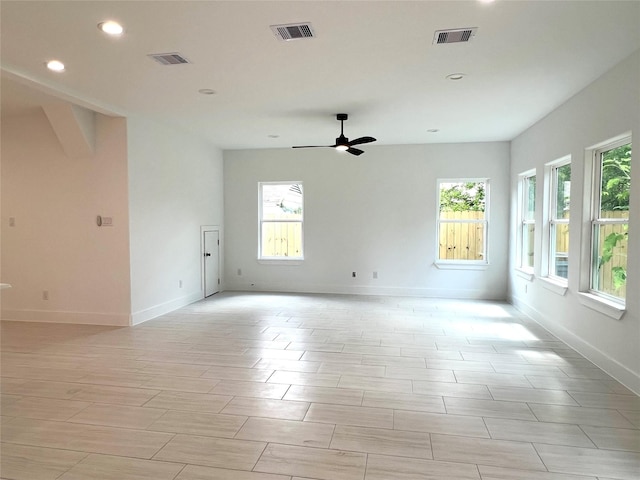 7107 Foster St Unit A, Houston, TX 77021 - empty room with healthy amount of natural light, recessed lighting, ceiling fan, and wood tiled floors
