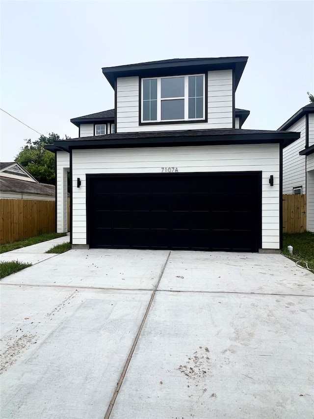 7107 Foster St Unit A, Houston, TX 77021 - view of front of house with an attached garage and driveway