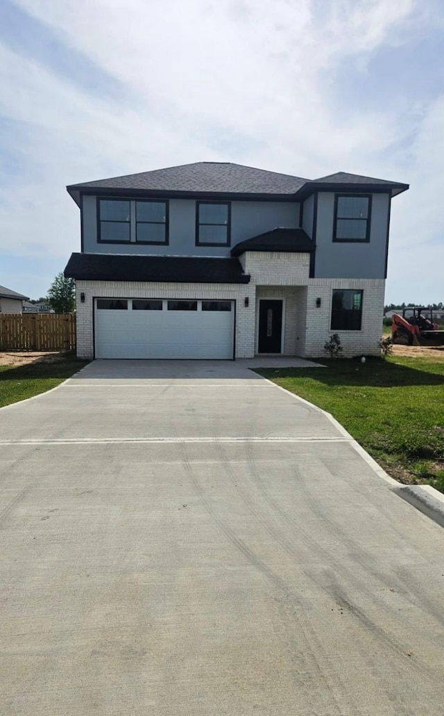 6197 Rd 5503, Cleveland, TX 77327 - view of front facade with a garage, driveway, and brick siding