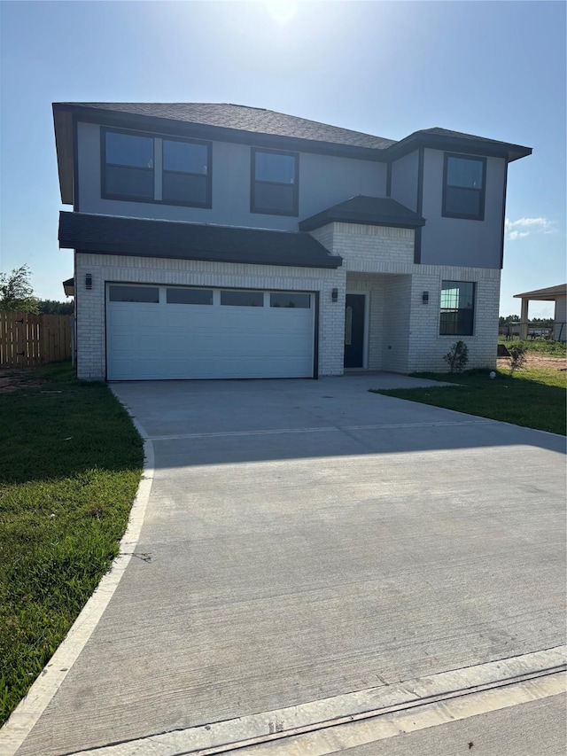 6197 Rd 5503, Cleveland, TX 77327 - view of front of property with brick siding, driveway, and a garage