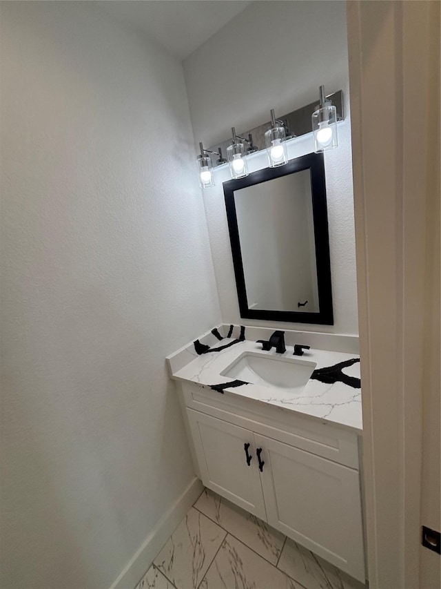 6197 Rd 5503, Cleveland, TX 77327 - bathroom featuring vanity, baseboards, and marble look tiles