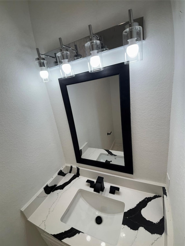 6197 Rd 5503, Cleveland, TX 77327 - bathroom with a textured wall and vanity