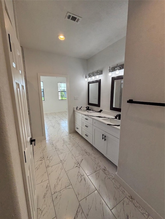 6197 Rd 5503, Cleveland, TX 77327 - full bath with double vanity, baseboards, marble finish floors, and recessed lighting