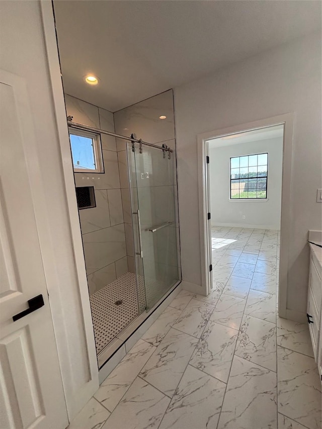 6197 Rd 5503, Cleveland, TX 77327 - bathroom featuring a stall shower, marble look tiles, vanity, recessed lighting, and baseboards