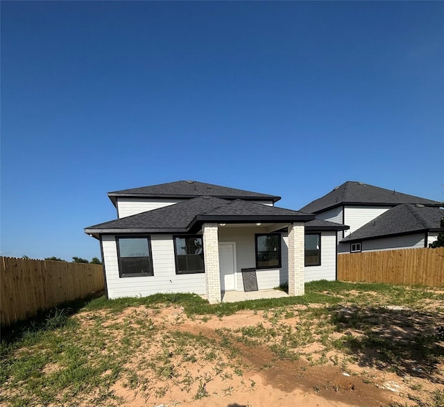 6197 Rd 5503, Cleveland, TX 77327 - rear view of property with a fenced backyard and a shingled roof