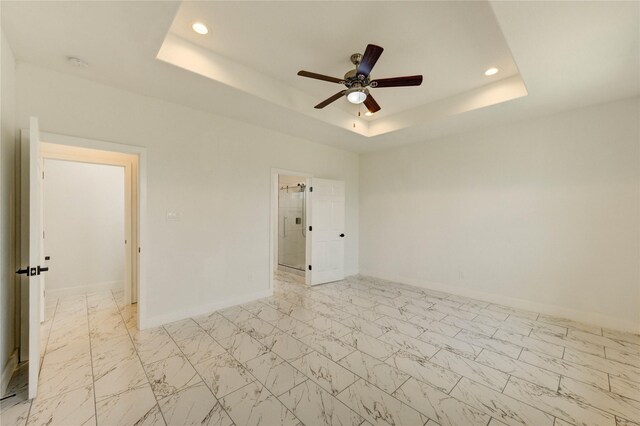 6197 Rd 5503, Cleveland, TX 77327 - empty room with a raised ceiling, recessed lighting, ceiling fan, a smoke detector, and baseboards