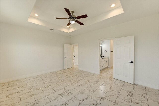 6197 Rd 5503, Cleveland, TX 77327 - empty room with a raised ceiling, a ceiling fan, baseboards, recessed lighting, and light marble finish floors