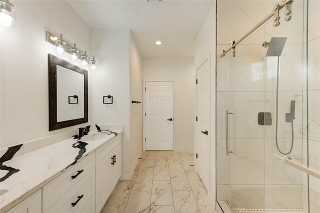 6197 Rd 5503, Cleveland, TX 77327 - full bath featuring marble look tile flooring, double vanity, a shower stall, recessed lighting, and baseboards