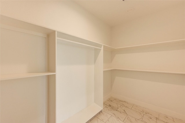 6197 Rd 5503, Cleveland, TX 77327 - walk in closet with marble look tile flooring
