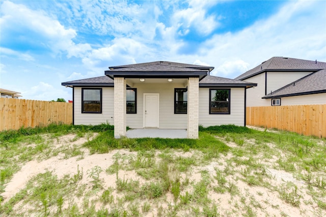 6197 Rd 5503, Cleveland, TX 77327 - rear view of property with a patio area, a fenced backyard, and a shingled roof