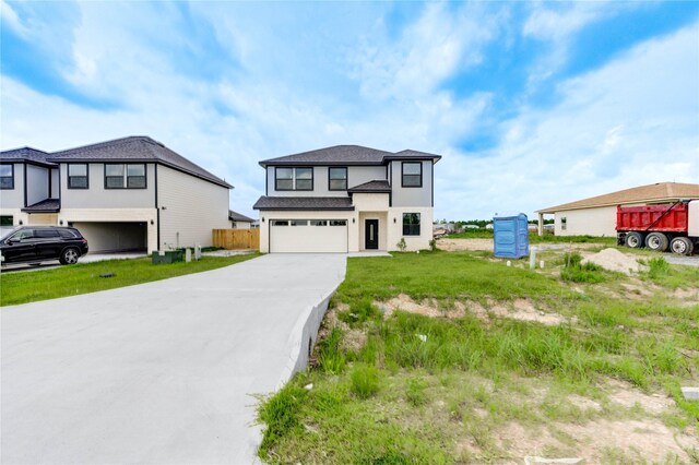 6197 Rd 5503, Cleveland, TX 77327 - view of front of house featuring an attached garage and concrete driveway