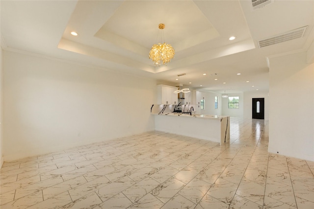6197 Rd 5503, Cleveland, TX 77327 - unfurnished living room with a raised ceiling, a chandelier, and recessed lighting