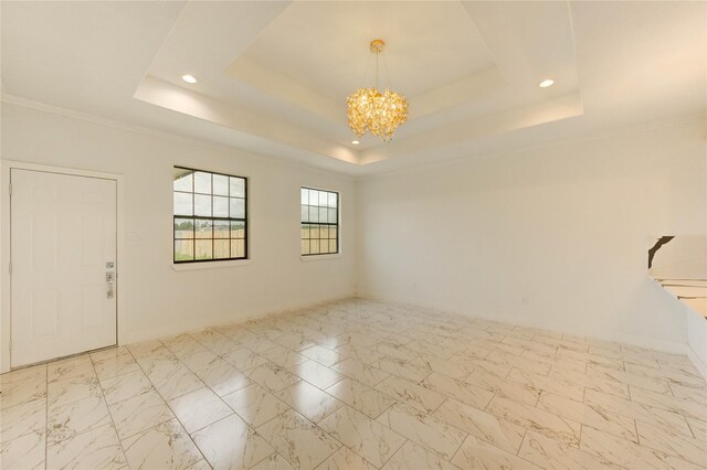 6197 Rd 5503, Cleveland, TX 77327 - unfurnished room with a chandelier, a tray ceiling, recessed lighting, and marble finish floors
