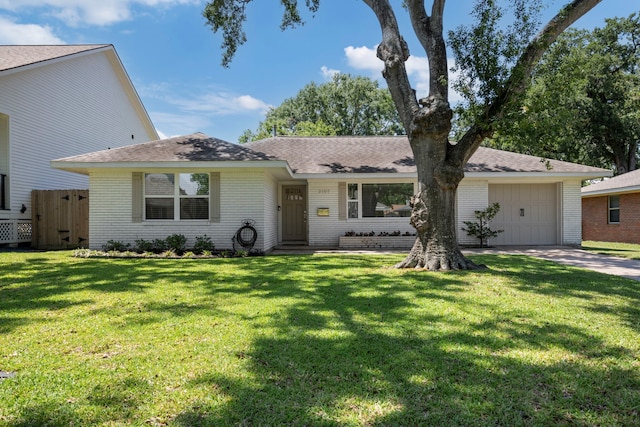 2107 Hewitt Dr, Houston, TX 77018 - view of front of property featuring a garage, brick siding, driveway, and a front yard