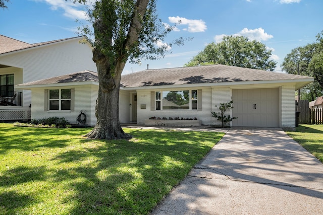 2107 Hewitt Dr, Houston, TX 77018 - view of front facade with a garage, driveway, a front yard, and brick siding