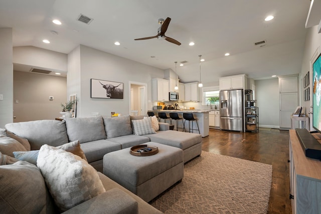 2107 Hewitt Dr, Houston, TX 77018 - living room with vaulted ceiling, a ceiling fan, recessed lighting, and dark wood-type flooring