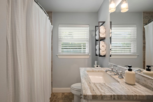 2107 Hewitt Dr, Houston, TX 77018 - bathroom with toilet, vanity, wood finished floors, and baseboards