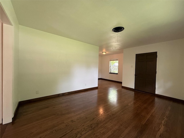 2016 N Tinsley St, Angleton, TX 77515 - spare room featuring dark wood finished floors and baseboards