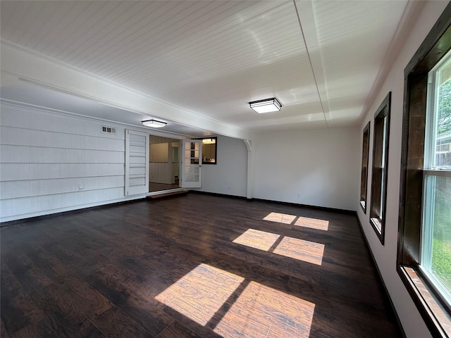 2016 N Tinsley St, Angleton, TX 77515 - spare room with dark wood-style flooring, plenty of natural light, and baseboards