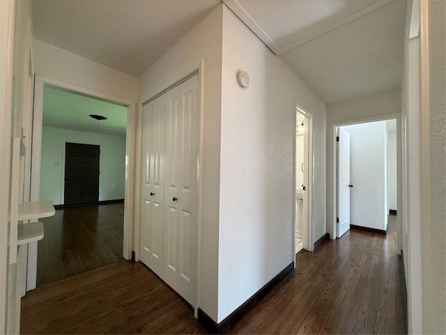2016 N Tinsley St, Angleton, TX 77515 - hallway with dark wood-style floors and baseboards