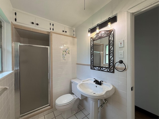 2016 N Tinsley St, Angleton, TX 77515 - full bath featuring tile walls, a shower stall, toilet, tile patterned flooring, and wainscoting