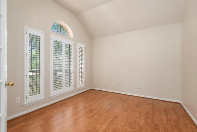 30 Teak Mill Pl, The Woodlands, TX 77382 - spare room with wood finished floors, lofted ceiling, and baseboards