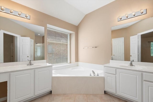 30 Teak Mill Pl, The Woodlands, TX 77382 - full bathroom featuring two vanities, a bath, tile patterned floors, a shower stall, and lofted ceiling