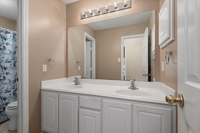 30 Teak Mill Pl, The Woodlands, TX 77382 - bathroom featuring double vanity, toilet, and a shower with curtain