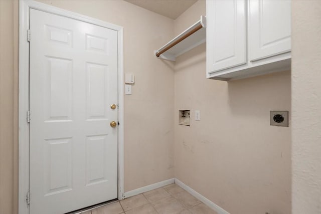 30 Teak Mill Pl, The Woodlands, TX 77382 - laundry room with cabinet space, hookup for an electric dryer, hookup for a washing machine, baseboards, and light tile patterned flooring