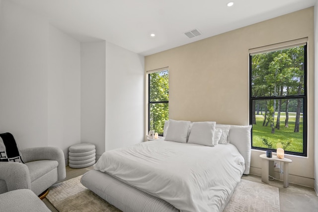 11736 Canyon Ct, Conroe, TX 77385 - bedroom featuring multiple windows and recessed lighting