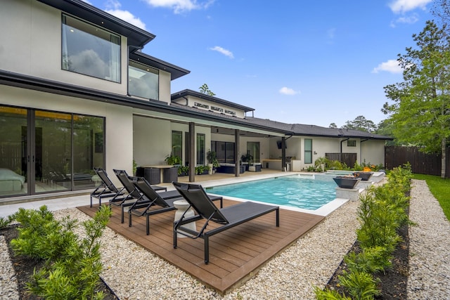 11736 Canyon Ct, Conroe, TX 77385 - rear view of house featuring stucco siding, french doors, a patio area, and an outdoor hangout area