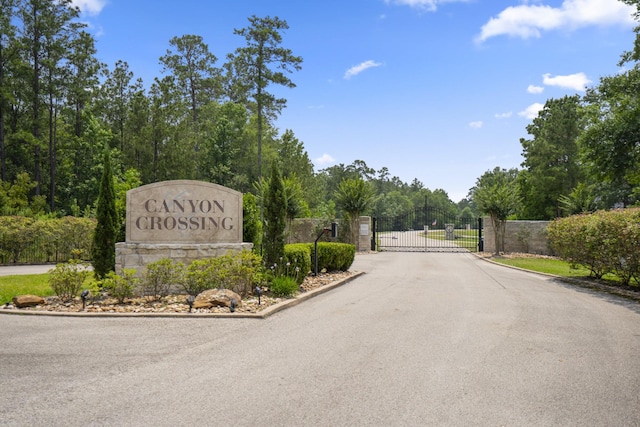 11736 Canyon Ct, Conroe, TX 77385 - community sign featuring a gate