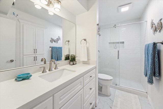 12500 Melville Dr Unit 114B, Montgomery, TX 77356 - full bath with marble finish floors, vanity, a stall shower, and toilet