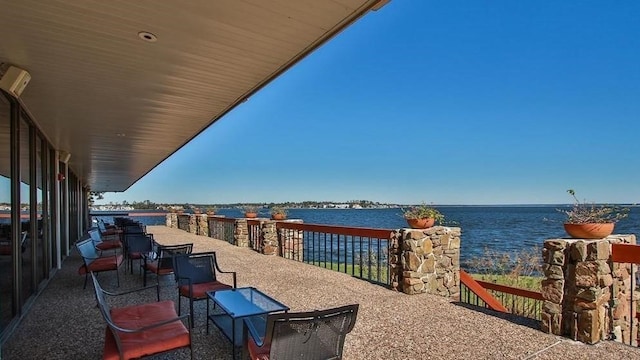 12500 Melville Dr Unit 114B, Montgomery, TX 77356 - view of patio with a water view