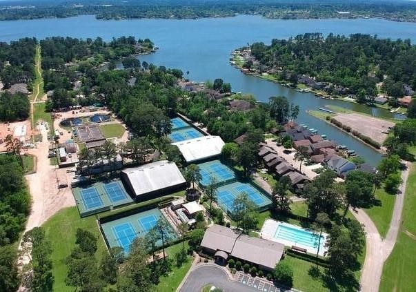 12500 Melville Dr Unit 114B, Montgomery, TX 77356 - aerial view of property and surrounding area with a nearby body of water
