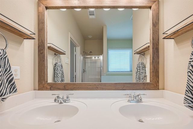 723 Hinsdale, Magnolia, TX 77354 - bathroom with double vanity, an enclosed shower, and a textured wall