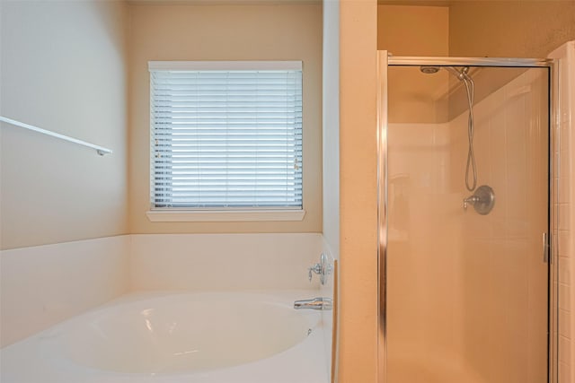 723 Hinsdale, Magnolia, TX 77354 - full bathroom featuring a shower stall and a bath