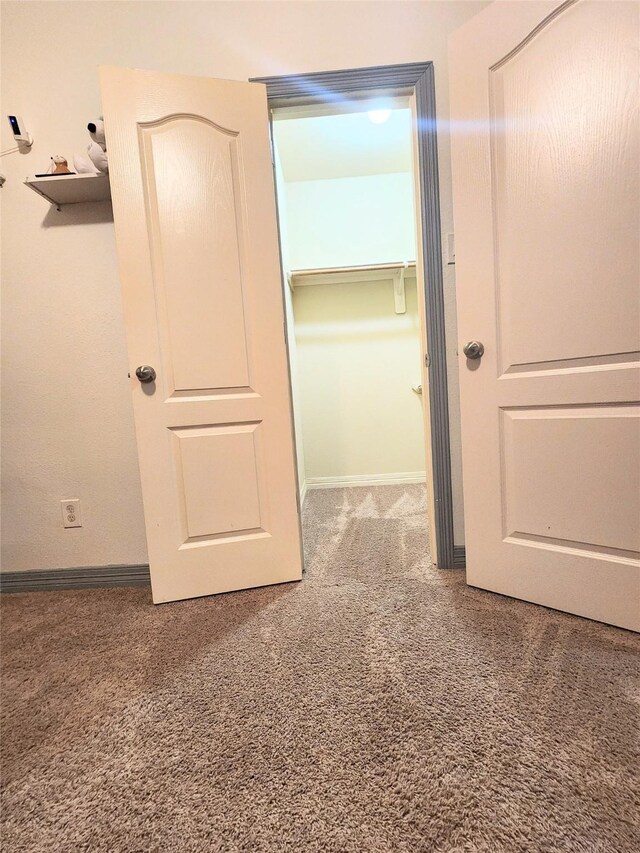 723 Hinsdale, Magnolia, TX 77354 - unfurnished bedroom featuring carpet flooring and baseboards