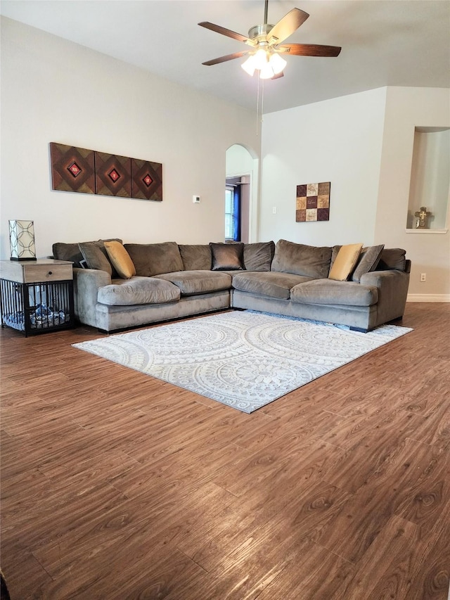 723 Hinsdale, Magnolia, TX 77354 - living room featuring wood finished floors, ceiling fan, arched walkways, and baseboards