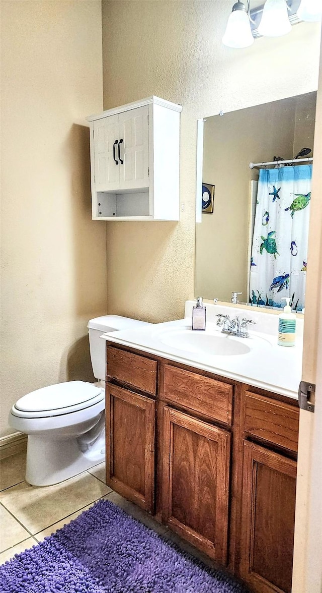 723 Hinsdale, Magnolia, TX 77354 - full bath featuring toilet, vanity, tile patterned flooring, a shower with shower curtain, and a textured wall