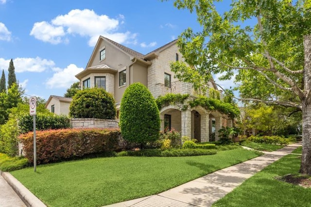 3019 Sunset Blvd, Houston, TX 77005 - view of front of house featuring stone siding, stucco siding, and a front yard
